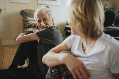 Senior couple doing yoga at home