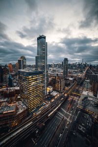 High angle view of street amidst buildings in city against sky