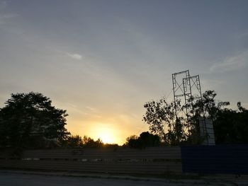 Silhouette trees against sky during sunset