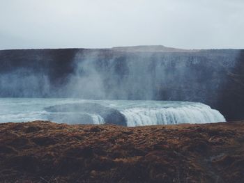 Scenic view of gullfoss falls against sky