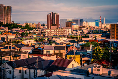 High angle view of buildings in city against sky