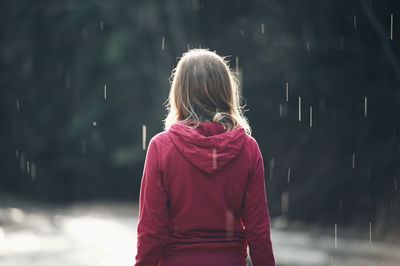 Rear view of girl in snow