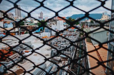 City seen through metallic window