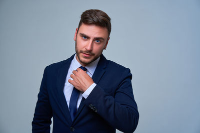 Portrait of man against white background