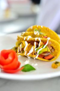 Close-up of tacos in plate on table