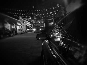 Illuminated city street at night