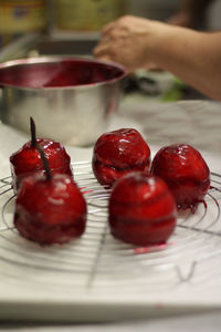 Close-up of hand holding strawberries
