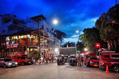 Cars on city street at night