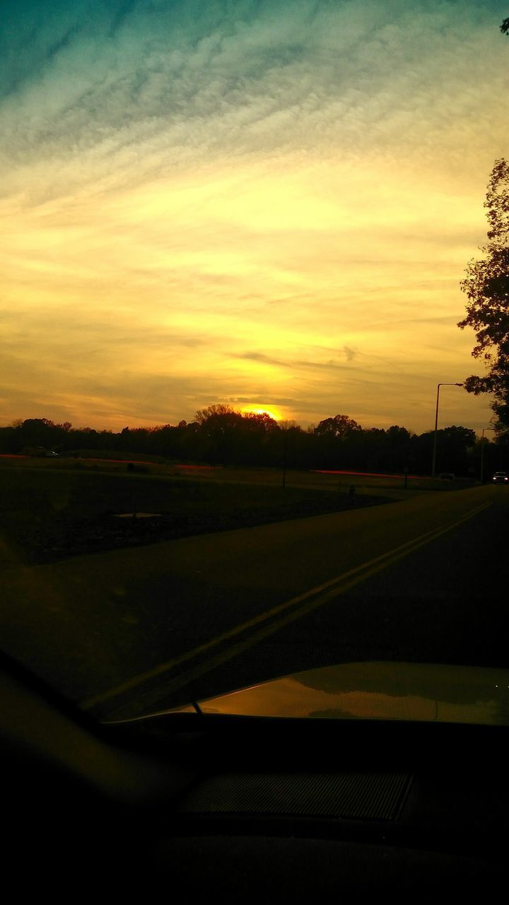 VIEW OF ROAD AGAINST SKY DURING SUNSET