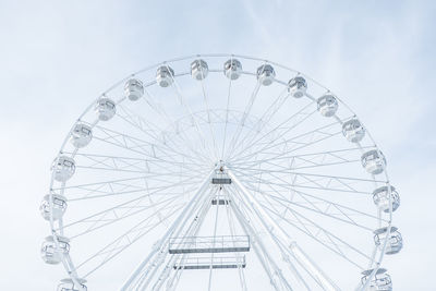 Low angle view of ferris wheel against sky