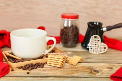 Close-up of coffee and cookies on table
