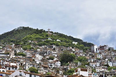 Aerial view of townscape against sky