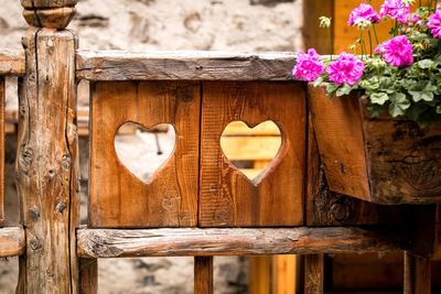 Close-up of heart shaped flower on wood