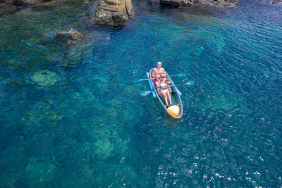 High angle view of man swimming in sea