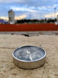 Close-up of clock on the beach