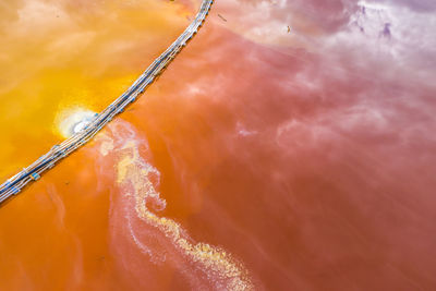 Aerial view of mining settling basin and lime supply. red polluted mine water from copper mine