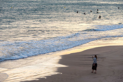 People walking on beach