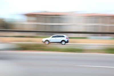 Blurred motion of car on road