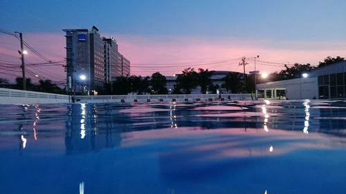 Surface level view of swimming pool at dusk