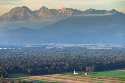 Scenic view of landscape and mountains against sky