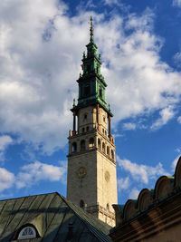 Low angle view of clock tower against sky