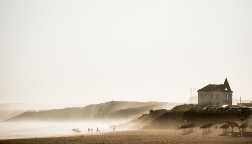 Scenic view of beach against clear sky