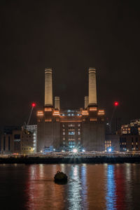 Night shot of battersea power station, reflections in water