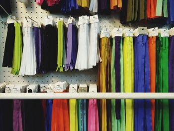 Close-up of colorful clothes hanging for sale