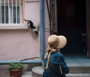 Full length of woman wearing hat