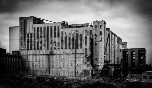 Low angle view of abandoned building against sky