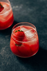 Close-up of red drink in glass on table