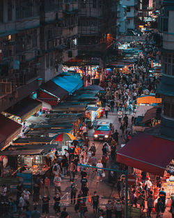 High angle view of illuminated buildings in city at night