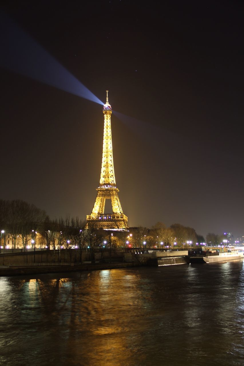 water, night, built structure, architecture, illuminated, waterfront, travel destinations, famous place, international landmark, travel, tourism, river, capital cities, sky, eiffel tower, clear sky, reflection, copy space, city, bridge - man made structure