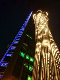 Low angle view of illuminated building at night