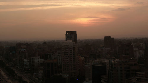 High angle view of city at sunset