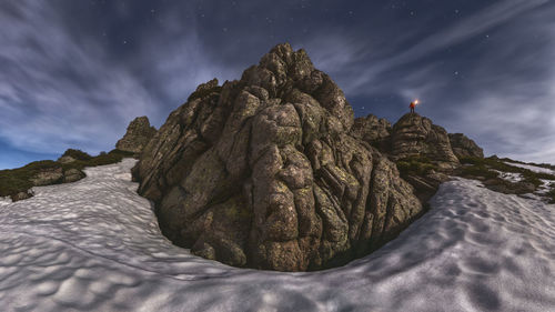 Low angle view of rock formations against sky