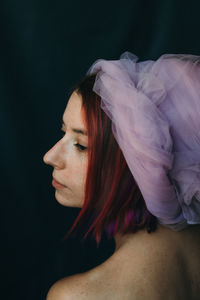 Portrait of young woman in darkroom