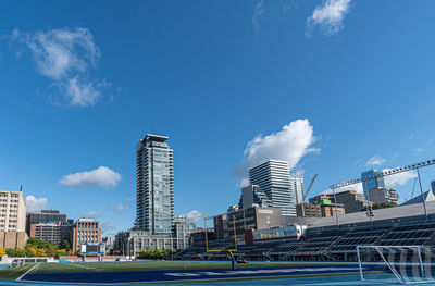 Modern buildings in city against sky
