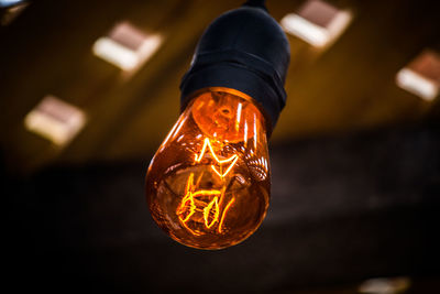 Close-up of illuminated light bulb