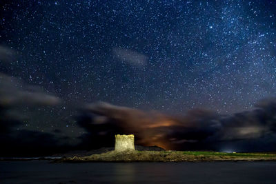 Scenic view of star field against sky at night