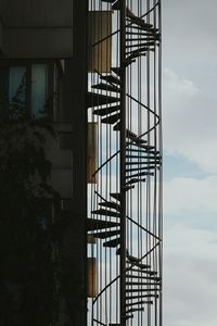 Low angle view of spiral stairs against the sky