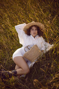  portrait woman in white clothes and in a wicker hat and with a basket  in autumn