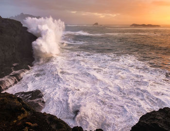 Scenic view of sea against sky during sunset