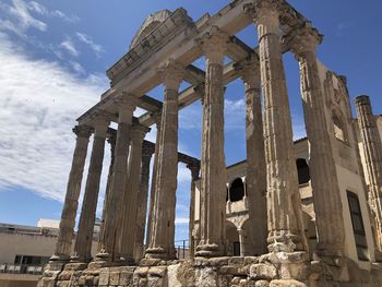 Low angle view of old ruins against sky