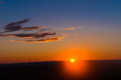 Scenic view of sea against romantic sky at sunset