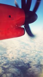 Close-up of airplane wing against sky