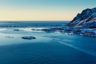 Scenic view of sea against clear blue sky