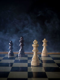 Close-up of chess pieces on table