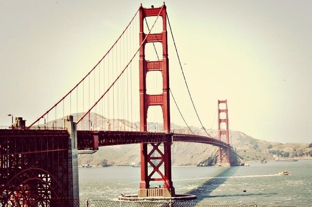 connection, bridge - man made structure, suspension bridge, engineering, built structure, golden gate bridge, transportation, architecture, water, bridge, travel destinations, international landmark, famous place, tourism, clear sky, travel, river, sea, cable-stayed bridge, sky