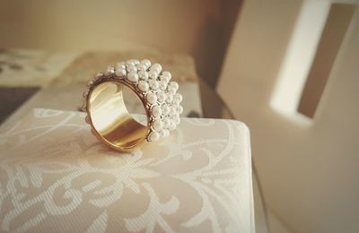 Close-up of pearl bangle on table at home